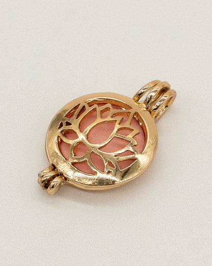 Gold Scent Locket with an intricate lotus flower design in a polished gold finish, featuring a soft pink insert for aromatherapy use.