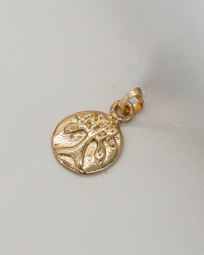 Close-up of a small gold charm pendant with a textured tree design, suitable for adding to a Charm Bracelet.