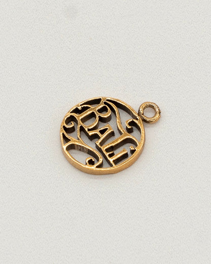 Close-up of a gold-tone circular charm pendant with an intricate cutout design, intended as an accessory for Charm Earrings.